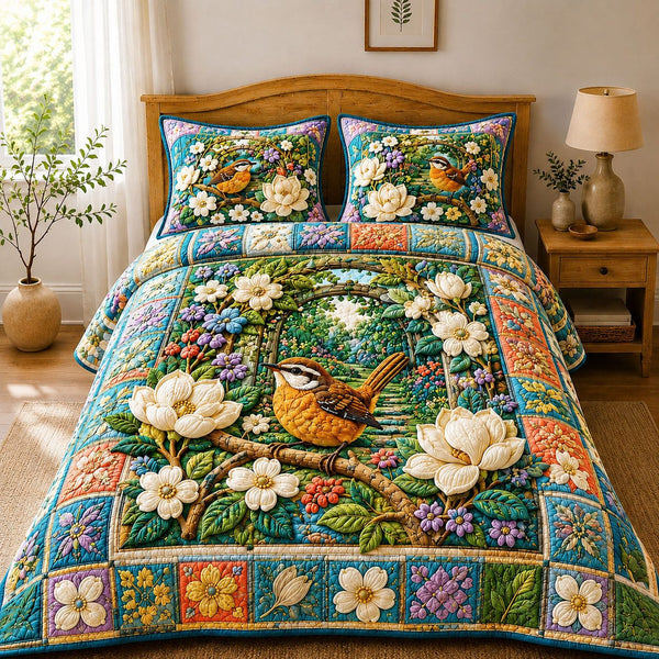 Secret Garden Wren quilted 3-piece bedding set on a made bed with two matching pillow shams