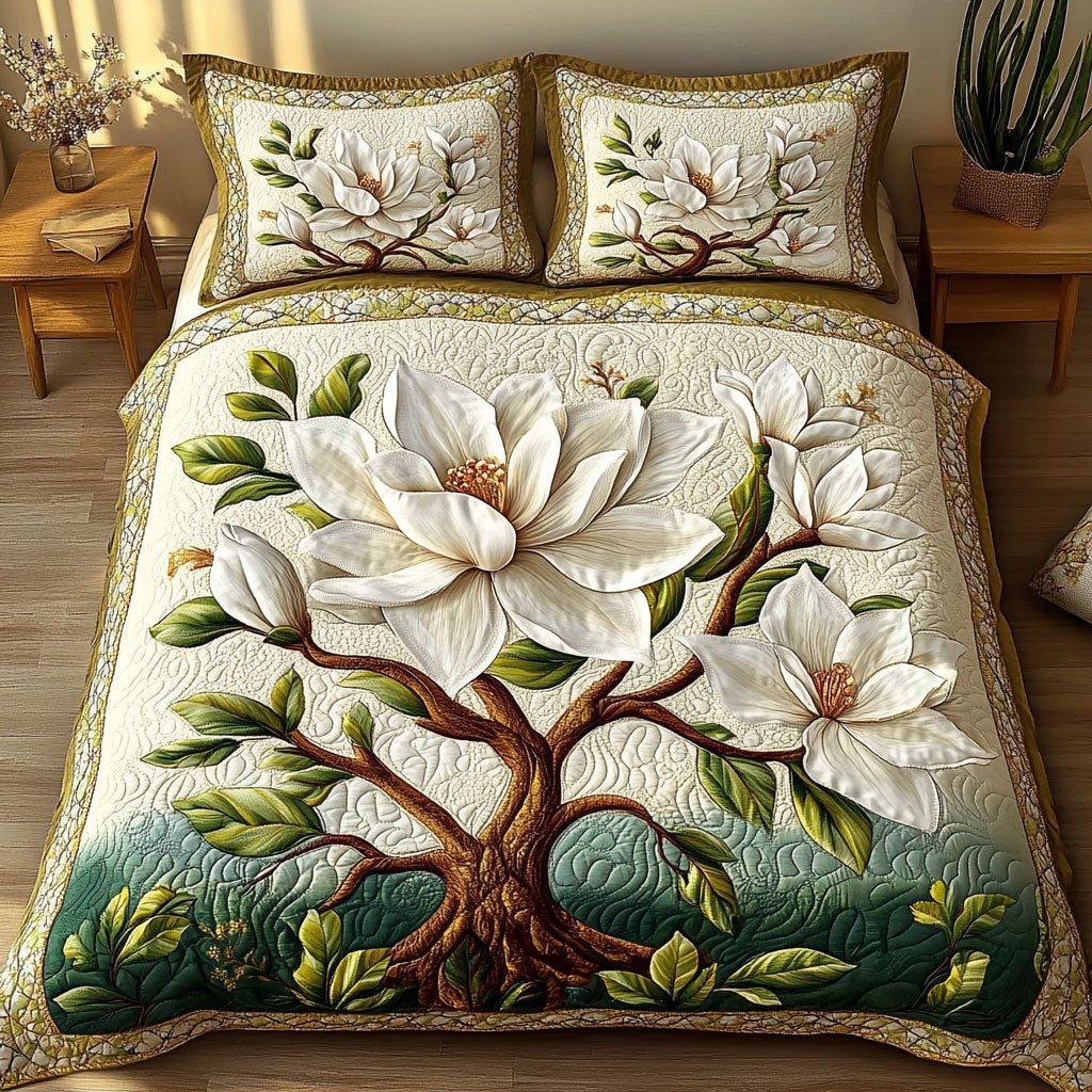 Serene Magnolia Bloom quilted 3-piece bedding set on a made bed with two matching pillow shams