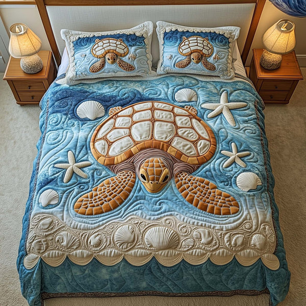 Shell Haven quilted 3-piece bedding set on a made bed in a light coastal bedroom