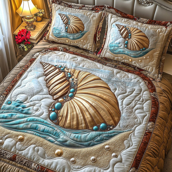 Shell quilted 3-piece bedding set on a made bed in a light coastal bedroom