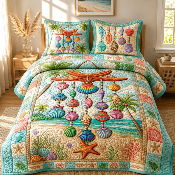 Shell Wind Chime quilted 3-piece bedding set on a made bed in a light coastal bedroom