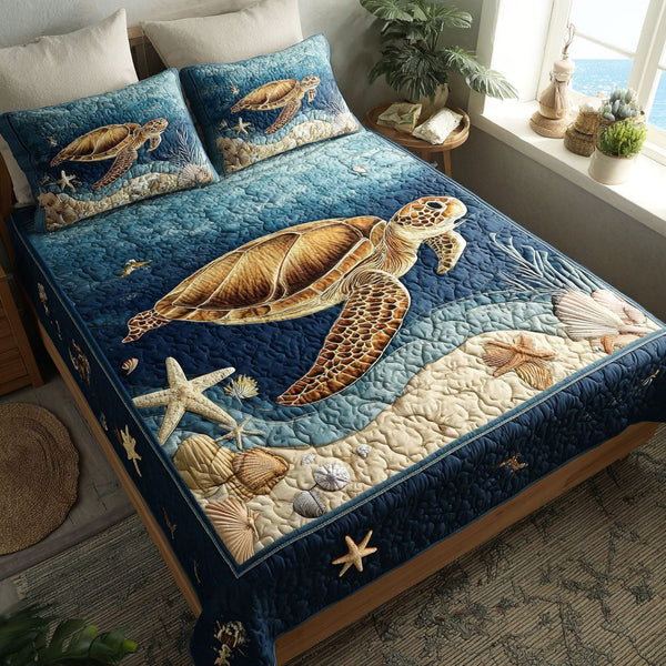Shellbound quilted 3-piece bedding set on a made bed with two matching pillow shams