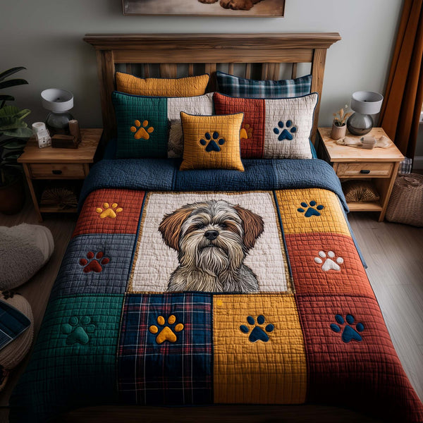 Shih tzu Paws quilted 3-piece bedding set on a made bed with two matching pillow shams