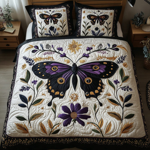 Shimmer Moth quilted 3-piece bedding set on a made bed with two matching pillow shams