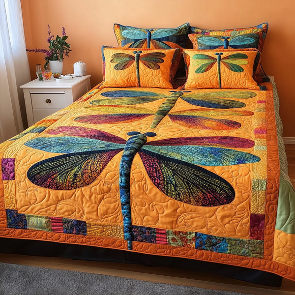 Shining Dragonfly quilted 3-piece bedding set on a made bed with two matching pillow shams