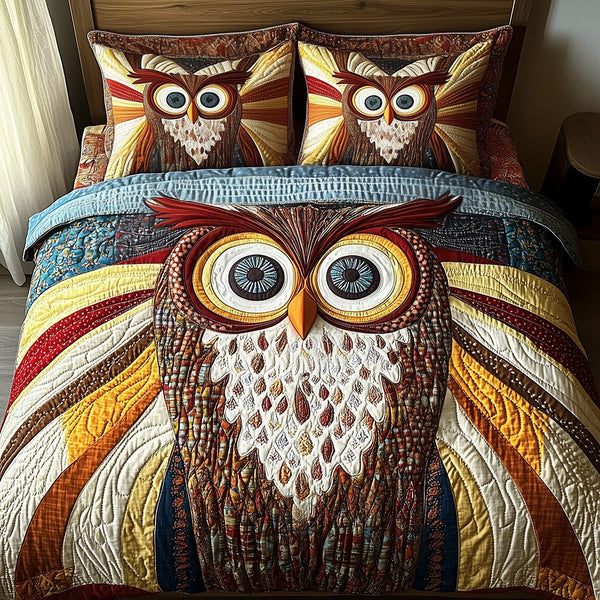 Shining Owl quilted 3-piece bedding set on a made bed with two matching pillow shams