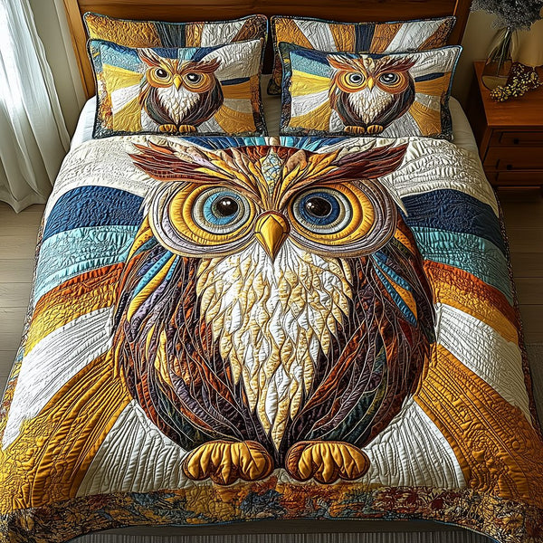 Shining Owl quilted 3-piece bedding set on a made bed with two matching pillow shams