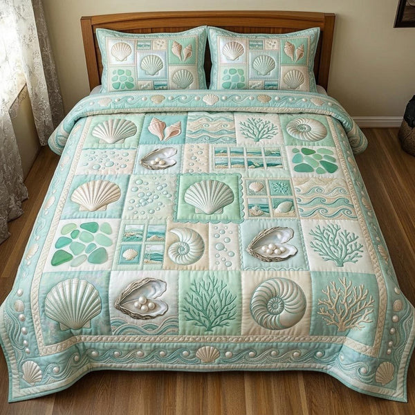Shoreline Gems quilted 3-piece bedding set on a made bed in a light coastal bedroom