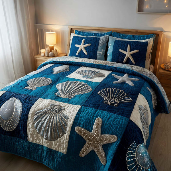 Shoreline Gems quilted 3-piece bedding set on a made bed in a light coastal bedroom