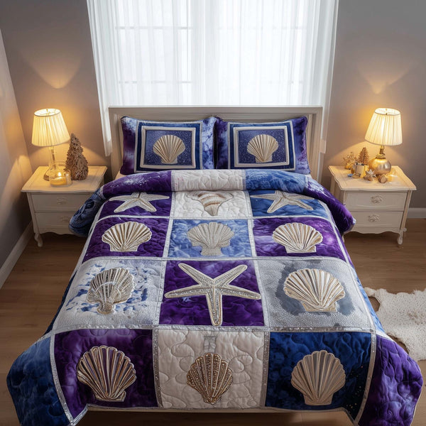 Shoreline Gems quilted 3-piece bedding set on a made bed in a light coastal bedroom