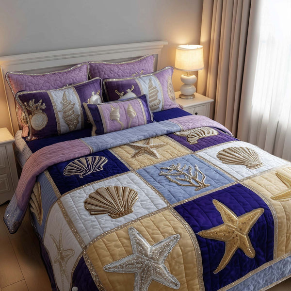 Shoreline Gems quilted 3-piece bedding set on a made bed in a light coastal bedroom