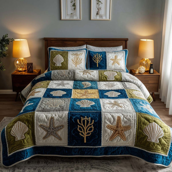 Shoreline Gems quilted 3-piece bedding set on a made bed in a light coastal bedroom