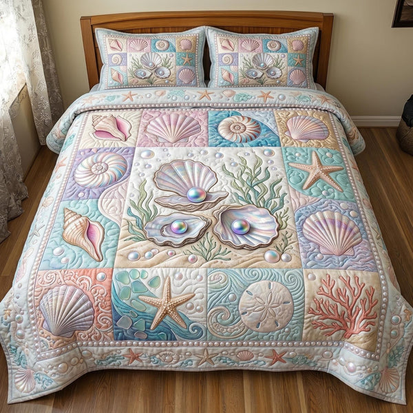 Shoreline Serenity quilted 3-piece bedding set on a made bed in a light coastal bedroom