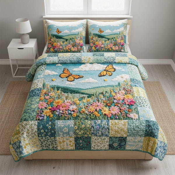 Sky Drift quilted 3-piece bedding set on a made bed with two matching pillow shams