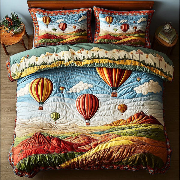 Sky Journey quilted 3-piece bedding set on a made bed with two matching pillow shams