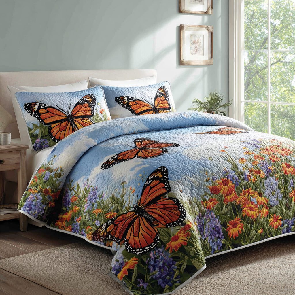 Sky Monarchs quilted 3-piece bedding set on a made bed with two matching pillow shams