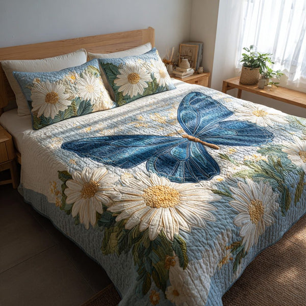 Sky Petals quilted 3-piece bedding set on a made bed with two matching pillow shams