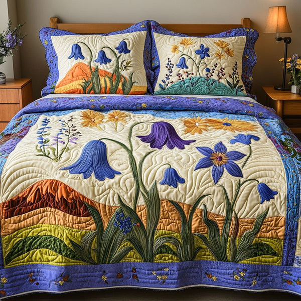 Skybound Petals quilted 3-piece bedding set on a made bed with two matching pillow shams