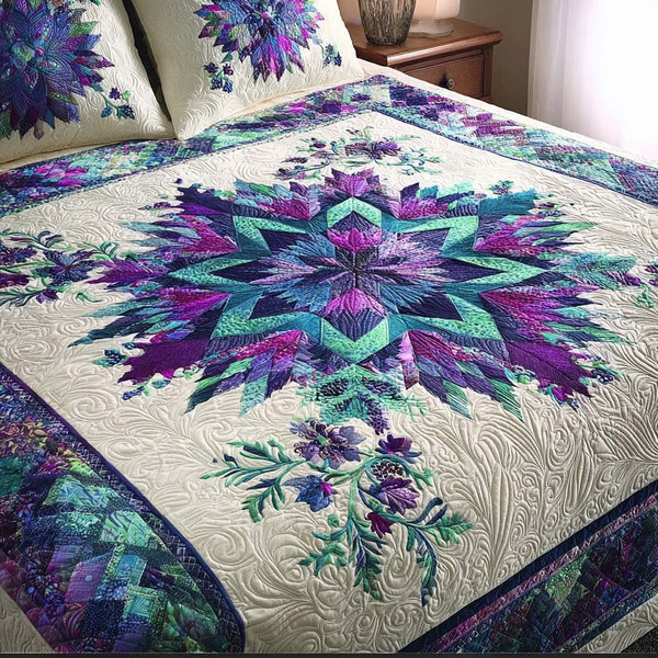 Skyforge Star quilted 3-piece bedding set on a made bed with two matching pillow shams