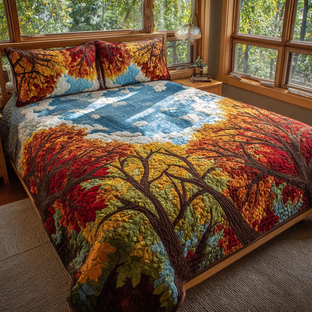 Skyward Autumn quilted 3-piece bedding set on a made bed with two matching pillow shams