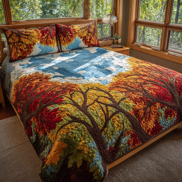 Skyward Autumn quilted 3-piece bedding set on a made bed with two matching pillow shams