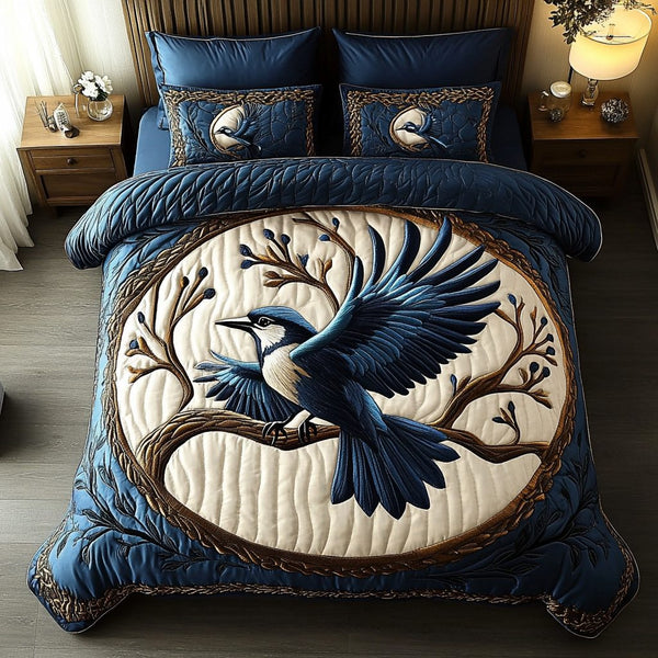 Skyward Bluejay quilted 3-piece bedding set on a made bed with two matching pillow shams
