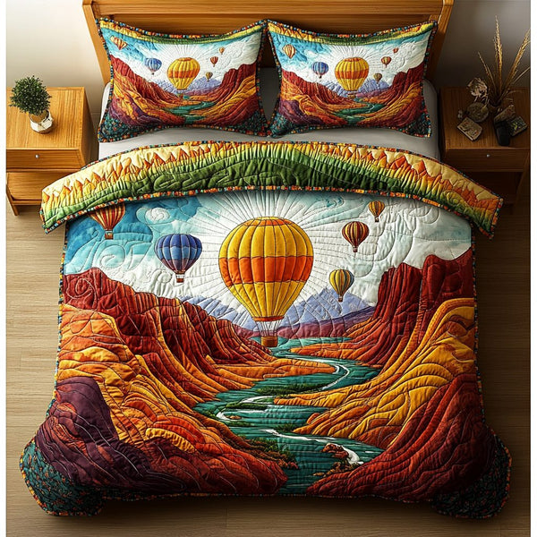 Skyward Bound quilted 3-piece bedding set on a made bed with two matching pillow shams
