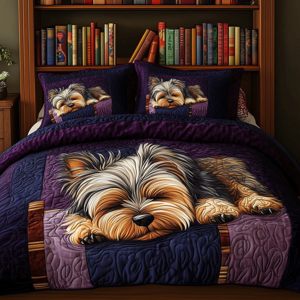 Sleeping Yorkie quilted 3-piece bedding set on a made bed with two matching pillow shams