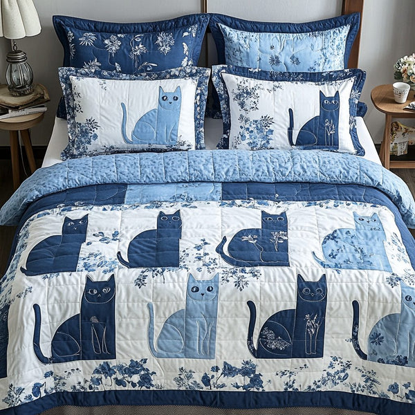 Sleepy Whiskers quilted 3-piece bedding set on a made bed with two matching pillow shams