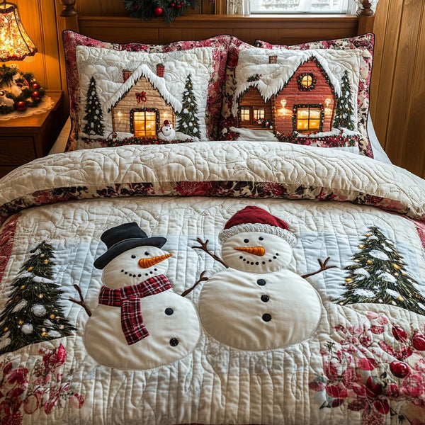 Snow Haven quilted 3-piece bedding set on a made bed with two matching pillow shams