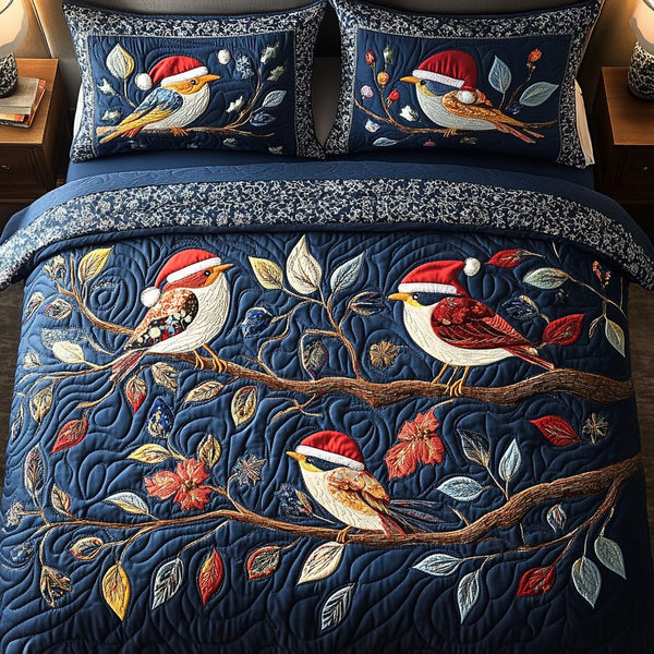Snowbird Serenade quilted 3-piece bedding set on a made bed with two matching pillow shams
