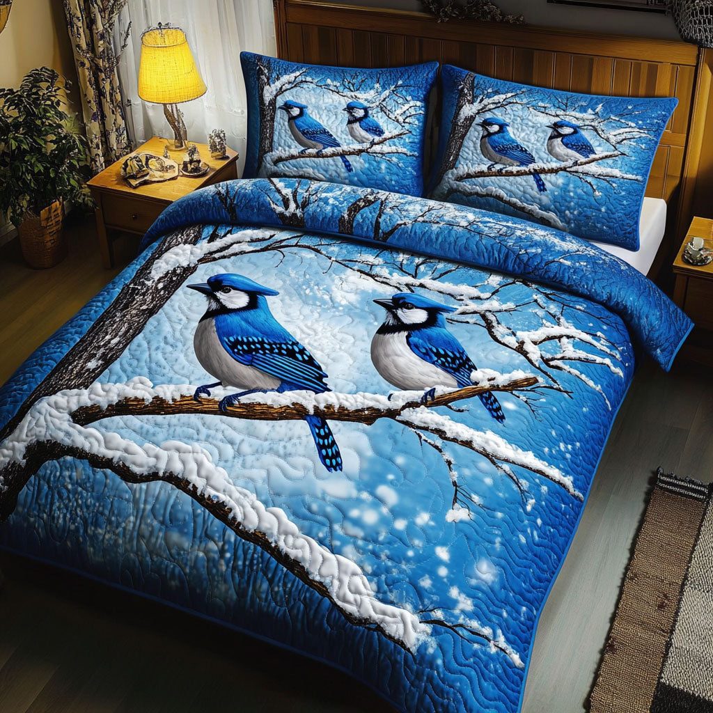 Snowy Branch Jays quilted 3-piece bedding set on a made bed in a rustic timber bedroom