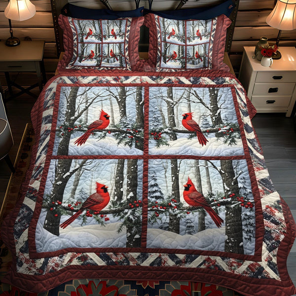 Snowy Cardinal Dreams quilted 3-piece bedding set on a made bed with two matching pillow shams