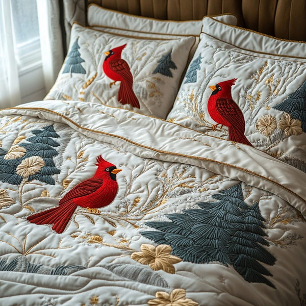 Snowy Cardinal quilted 3-piece bedding set on a made bed with two matching pillow shams