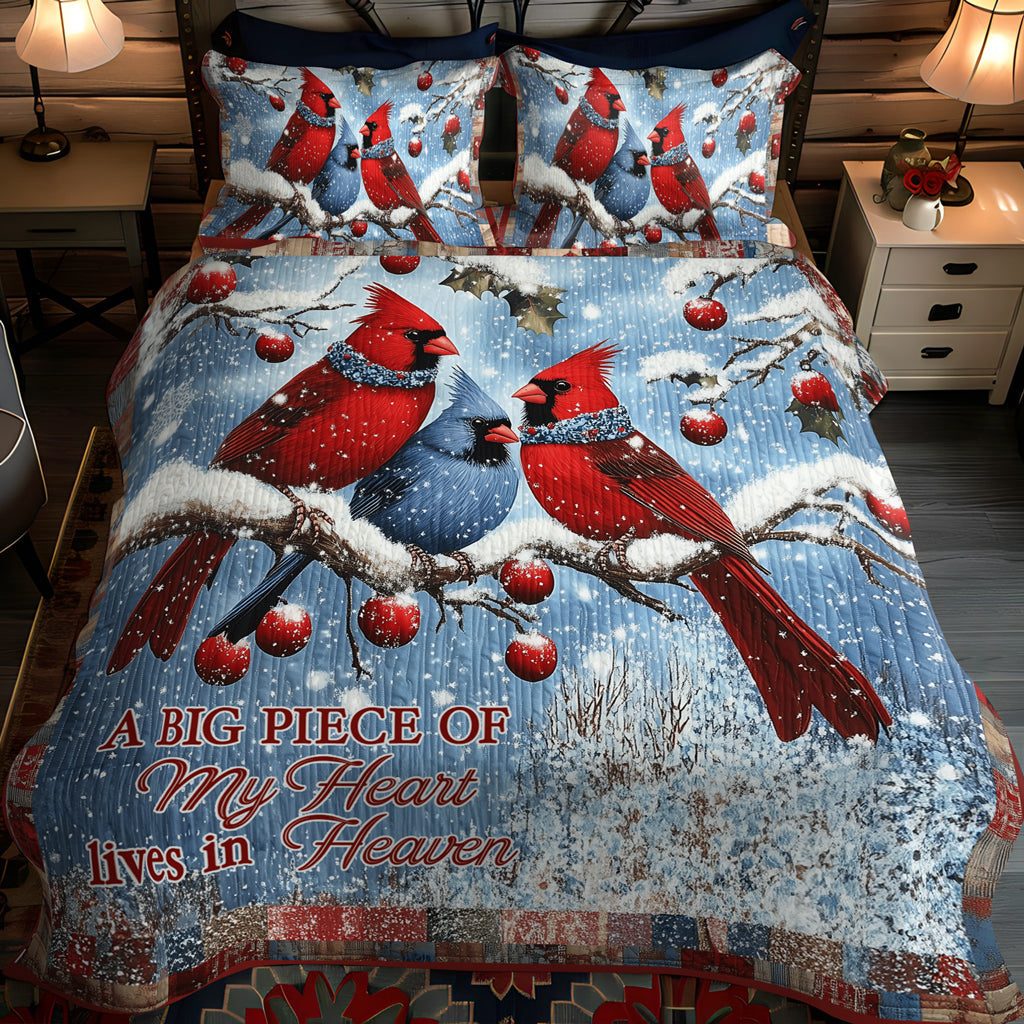 Snowy Cardinal quilted 3-piece bedding set on a made bed with two matching pillow shams