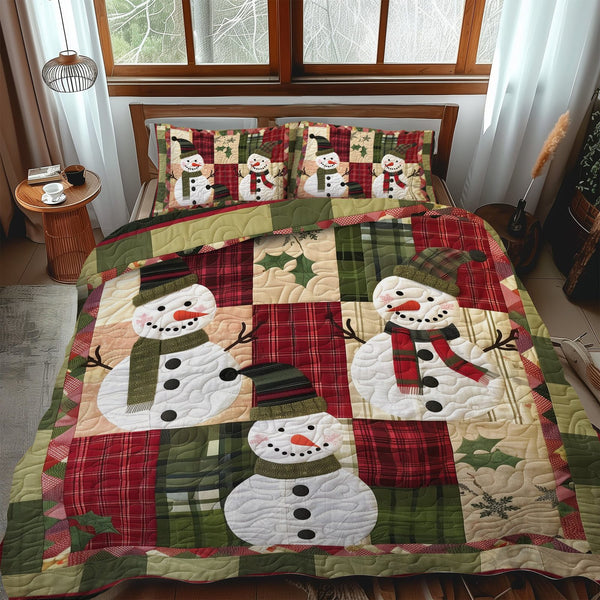 Snowy Delight quilted 3-piece bedding set on a made bed with two matching pillow shams