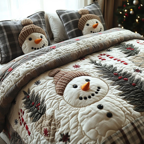 Snowy Joy quilted 3-piece bedding set on a made bed with two matching pillow shams