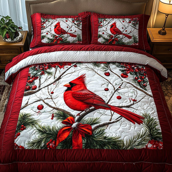 Snowy Perch quilted 3-piece bedding set on a made bed with two matching pillow shams