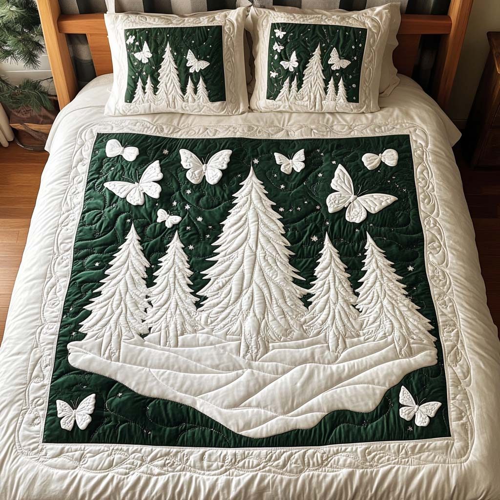 Snowy Serenity quilted 3-piece bedding set on a made bed with two matching pillow shams