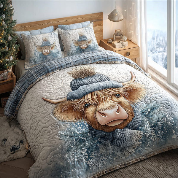 Snowy Snug Highland Cow quilted 3-piece bedding set on a made bed with two matching pillow shams