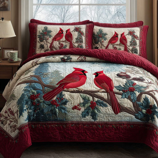 Snowy Songbirds quilted 3-piece bedding set on a made bed with two matching pillow shams