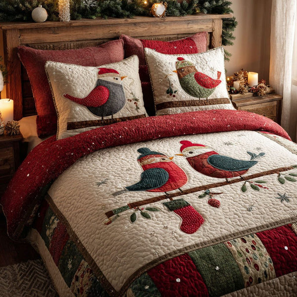 Snowy Songbirds quilted 3-piece bedding set on a made bed with two matching pillow shams