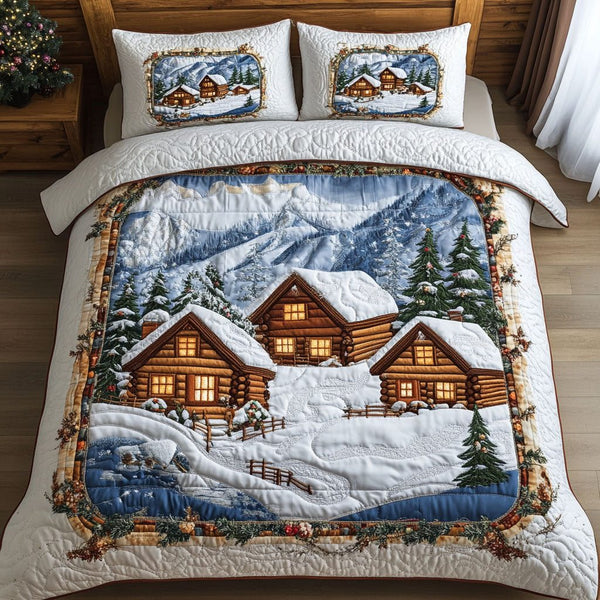 Snowy Village Cabins quilted 3-piece bedding set on a made bed with two matching pillow shams