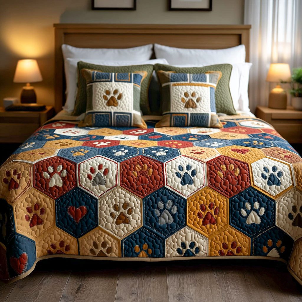 Snuggle Paws quilted 3-piece bedding set on a made bed with two matching pillow shams