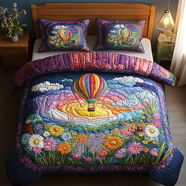Soaring Serenity quilted 3-piece bedding set on a made bed with two matching pillow shams