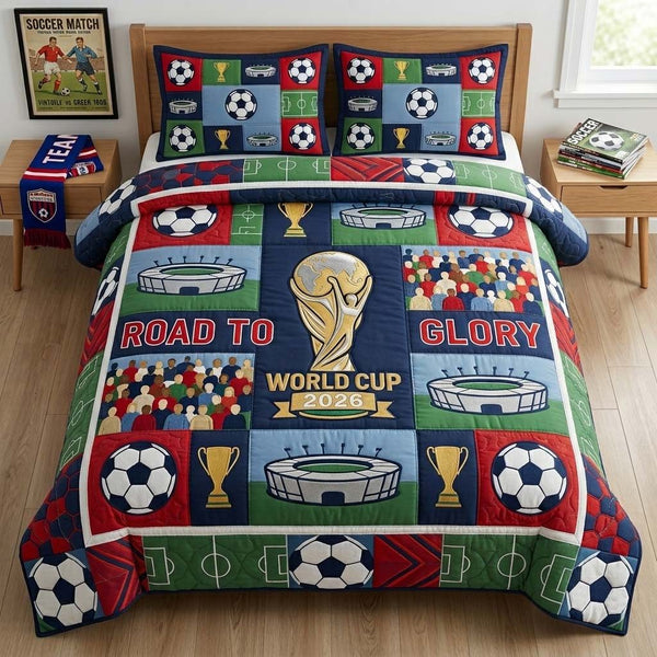 Soccer Patch Glory quilted 3-piece bedding set on a made bed with two matching pillow shams