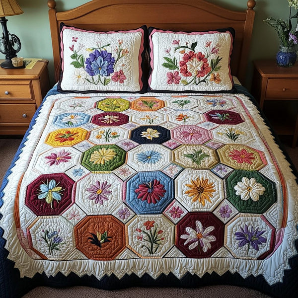 Soft Petals quilted 3-piece bedding set on a made bed with two matching pillow shams