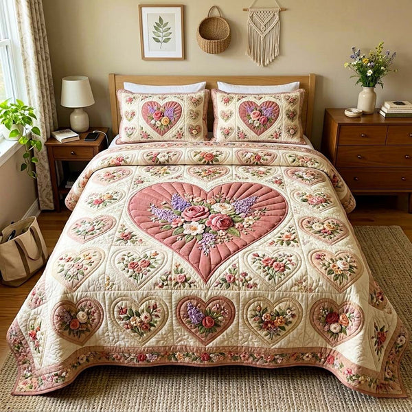 Soft Romance quilted 3-piece bedding set on a made bed with two matching pillow shams