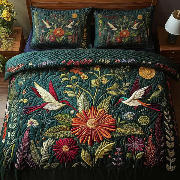 Songbird Charm quilted 3-piece bedding set on a made bed with two matching pillow shams
