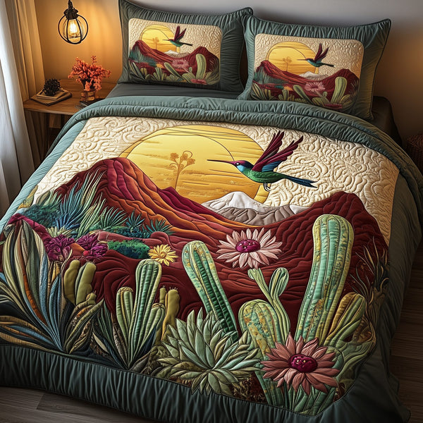 Southwest Spiritual Hummingbird quilted 3-piece bedding set on a made bed with two matching pillow shams